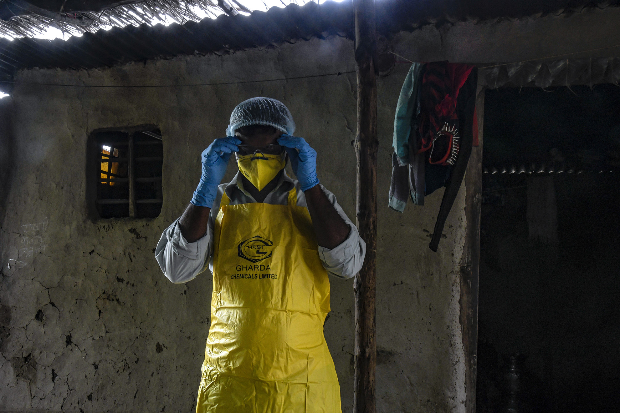 Sumesh Kenade shows safety gear at his home in Loni village given to him by revenue department while giving him financial compensation because of pestiside poisioning.